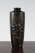 A Japanese bronze vase, Meiji period, inlaid in relief with a chrysanthemum, on a brown to black