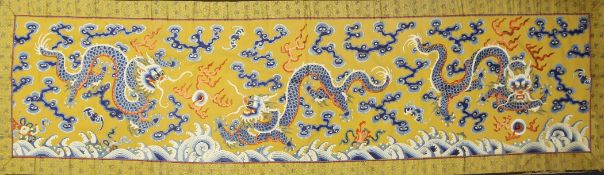 A Chinese embroidered silk `dragon` panel, late 19th / early 20th century, decorated with three