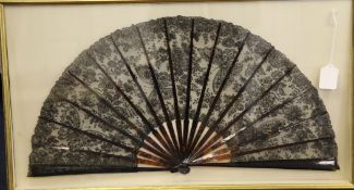 A 19th century tortoiseshell fan and a 19th century black lace and mother of pearl and white lace,