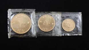 A cased set of three 1970`s Omani gold coins, 100 Baiza, 50 Baiza and 25 Baiza.