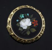 A late 19th century gold mounted pietra dura brooch, of circular form, decorated with flowers, 1.