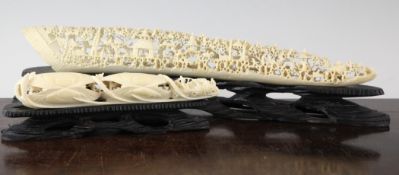 Two Chinese ivory tusk carvings, early 20th century, the first profusely carved and pierced with