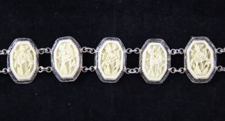 A Chinese export ivory and white metal belt, late 19th /early 20th century, composed of nineteen