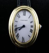 A lady`s 1980`s 18ct gold Must de Cartier manual wind wrist watch, with oval convex Roman dial and