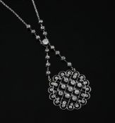 A fine Edwardian Belle epoque platinum and millegrain diamond set pendant necklace, the chain set