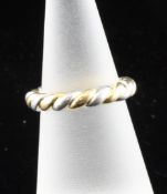 A Cartier 18ct gold and platinum band, of rope twist design, 8 grams, size L.