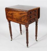 A Victorian flame mahogany drop leaf work table, with three drawers and dummy drawers on reeded