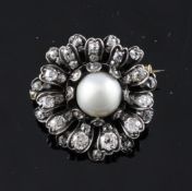 A Victorian gold and silver single pearl and diamond cluster brooch, of foliate design, 1.25in