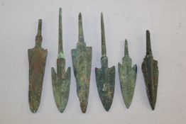 A collection of six Greek bronze arrow heads, c.8th century B.C., largest 4.75in.