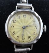 A lady`s early 1930`s silver Rolex manual wind wrist watch, with sunburst Arabic dial, on associated