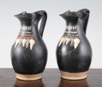 A pair of Greek Gnathian ware oinoche, c.4th century B.C., decorated in coloured slip with bunches