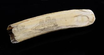 A 19th century Scrimshaw carved marine ivory tusk, decorated with a sailing ship, 7in.