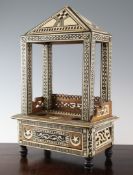 An early 20th century Islamic bone and ebony inlaid desk stand, with single drawer, lacking ink