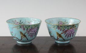 A pair of Chinese turquoise ground famille rose bowls, late 19th century, painted in famille rose