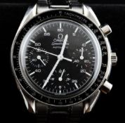 A gentleman`s late 1990`s stainless steel Omega Speedmaster automatic wrist watch, the black dial