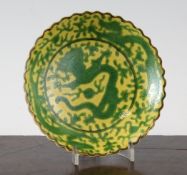 A Chinese green and yellow glazed `dragon` dish, Daoguang mark but later, with incised decoration of