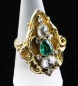 A Victorian style gold, emerald and diamond dress ring, of lozenge form with pear shaped emerald and