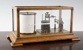 An Edwardian oak cased barograph, with a tier of seven vacuum discs, including ink bottle, 14in.