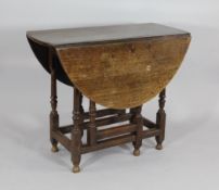An early 18th century oak gateleg table, on turned and block legs and turned feet, H.2ft 5in.