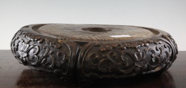 A large and heavy Chinese rosewood fish bowl stand, the border carved in high relief with lotus