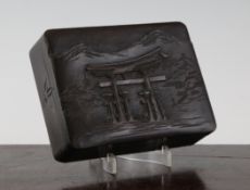 A Japanese wood rectangular box, early 20th century, the cover carved in relief with a Torii (Shinto