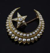 An Edwardian gold, diamond and split pearl set crescent and star brooch, 1.25in.