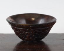 A Chinese archaistic horn cup, carved in relief with grotesque marks and chi-dragons, 4.1in.