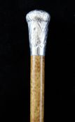 A modern silver mounted malacca walking cane, the silver embossed handle with hallmarks for D & N,