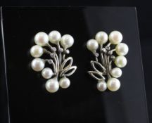 A pair of 18ct white gold, diamond and cultured pearl earrings, of foliate form, 1in.