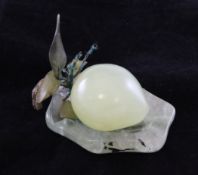 A Chinese bowenite carving of a pear, with a green quartz stand, 4in.