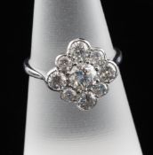 An 18ct white gold and diamond cluster ring, the nine stone total weight approximately 1.85ct,