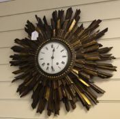 An early 20th century giltwood sunburst wall clock, with enamelled Roman dial, 21 x 22in.