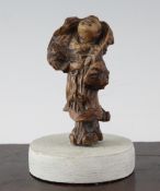 A Chinese rootwood carving of a Luohan, the burr wood forming his cloak at the back, 4.25in.;