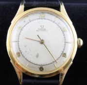 A gentleman`s late 1940`s 18ct gold Omega automatic wrist watch, with baton and Arabic numerals,