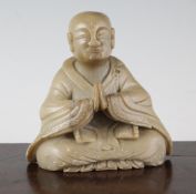 A Chinese soapstone seated figure of a Luohan, 19th century, 5.5in.
