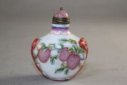 A Chinese enamelled glass snuff bottle, decorated with finger citrines and lychees among chi-dragons