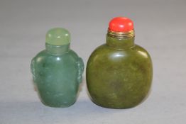 Two Chinese bowenite jade snuff bottles, the first of olive green tone, the second green carved with