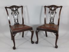 A set of six Chippendale design mahogany dining chairs, with pierced splat backs and drop in seats