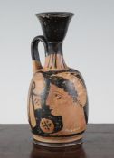 A Greek red-figure lekythos, Southern Italy, c.4th century B.C., decorated with the head of a lady