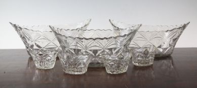 A part suite of late Georgian cut glass bowls and salts, comprising three boat shaped glass bowls