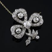 An Edwardian gold, platinum and diamond set shamrock brooch, the central stone in excess of 1.