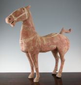 A large Chinese painted pottery figure of a standing horse, Han Dynasty (206 B.C. - 220 A.D.),