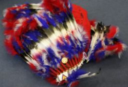 A North American Indian headdress, with various feathers and coloured beads, once the property of