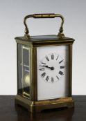 A gilt brass carriage clock, with enamelled Roman dial and movement striking on a gong, 5.5in.
