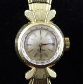 A lady`s early 1960`s 18ct gold Omega manual wind wrist watch, with baton numerals and fan shaped