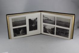 An Edwardian Japanese black lacquer photograph album, with a quantity of mostly silvered gelatin