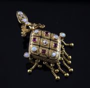 A late 19th/early 20th century French 18ct gold ruby, white opal, diamond and black enamel locket