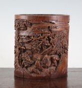 A Chinese bamboo brush pot, Bitong, carved in high relief with sages and attendants amid rockwork