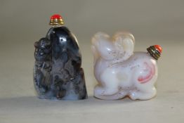 Two Chinese agate snuff bottles, the first carved in relief with a cicada, 5cm., the second as the