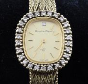 A lady`s 9ct gold and diamond set Bueche Girod wrist watch, the shaped oval dial with baton numerals